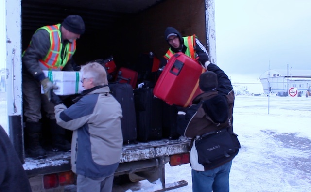 Loading luggage into the truck at Iqaluit airport | photo: Marnie Richardson