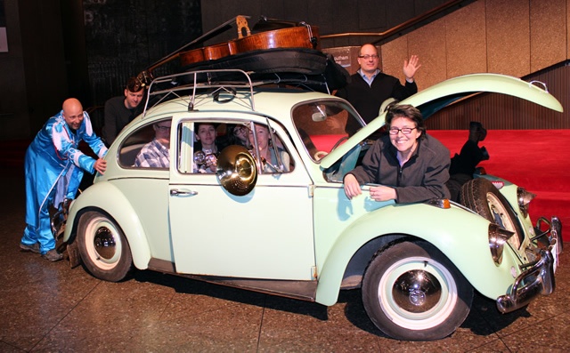 Mike Caluori, Head of Props pushes his 1967 VW Beetle filled with NAC Orchestra musicians